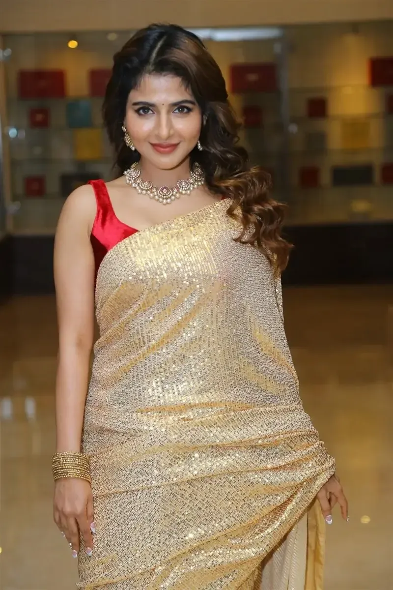 Iswarya Menon in Gold color Saree at Spy Movie Release Event